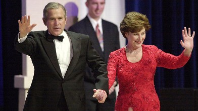 PHOTO: President George W. Bush and wife Laura wave to supporters while attending the Florida State Inaugural Ball Jan. 20, 2001 at the Pension Building in Washington D.C.