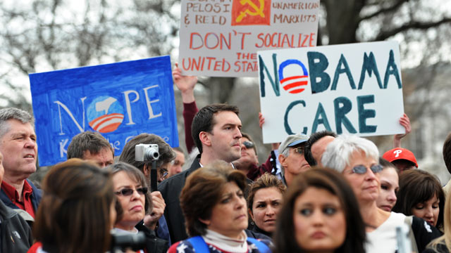 PHOTO: Participants display placards during a demonstration in Washington, DC, March 16, 2010 in opposition to the health care reform bill.