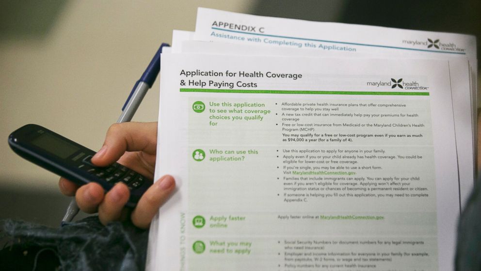 PHOTO: Health navigator Rebecca Wener holds a Maryland Health Connection health insurance marketplace written application at a Community Clinic Inc. health center in Takoma Park, Maryland, U.S., on Oct. 1, 2013.