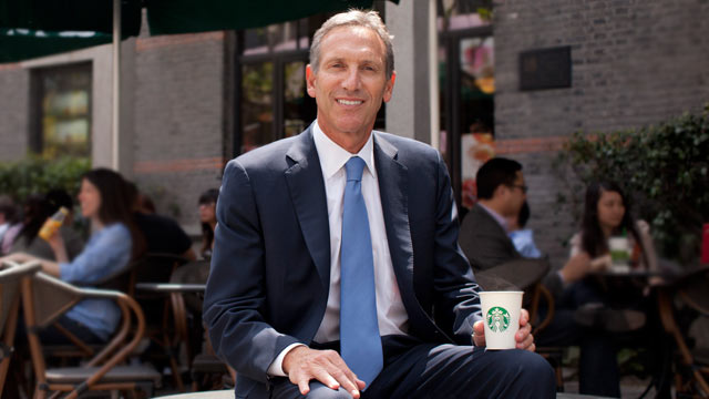 PHOTO: Howard Schultz, chief executive officer of Starbucks Corp. poses for a photograph outside one of the company's coffee shops, Shanghai, China, April 26, 2011.
