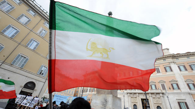 PHOTO: A demonstrator waves an Iranian flag during a demonstration against the Iranian regime in front of the Italian parliament, Rome, Italy, Feb. 11, 2010.