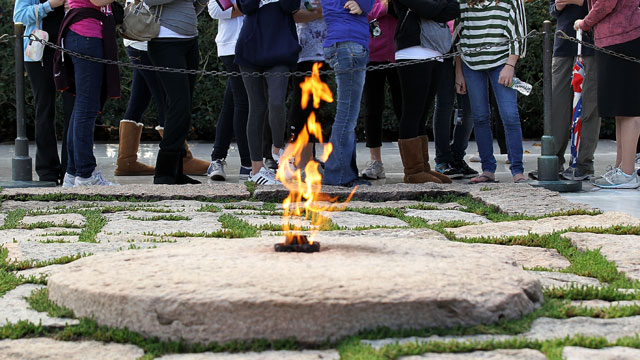 PHOTO: Tourists visit the gravesite of President John F. Kennedy October 28, 2010 at Arlington National Cemetery in Arlington, Virginia.