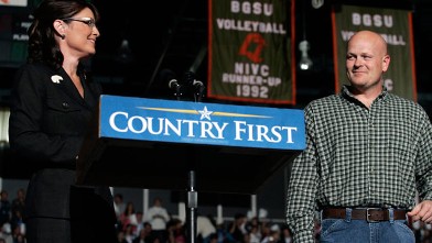 PHOTO: Joe Wurzelbacher looks on as Sarah Palin speaks October 29, 2008 at Bowling Green University in Bowling Green, Ohio. Joe Wurzelbacher, also known as "Joe the plumber" of Holland, Ohio, campaigned with Palin for the first time at the event.