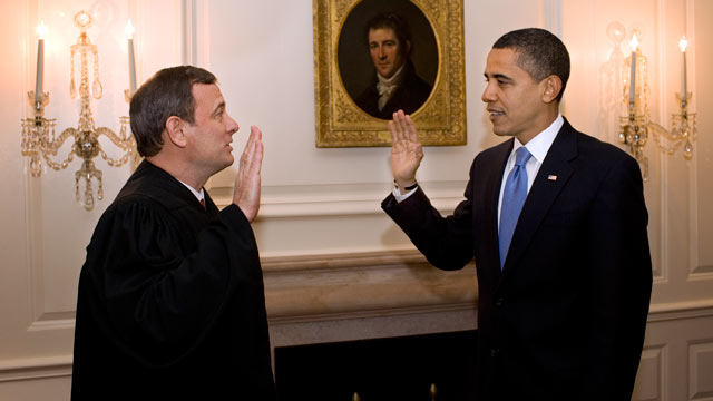 PHOTO: Chief Justice John G. Roberts Jr. administers the oath of office to President Barack Obama in the Map Room of the White House on Jan. 21, 2009.