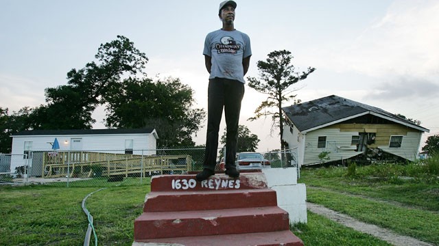 PHOTO: Warren Schexnader stands on the steps of his old home in front of another destroyed home, right, and the FEMA trailer he is currently living in, left, June 8, 2007 in New Orleans.