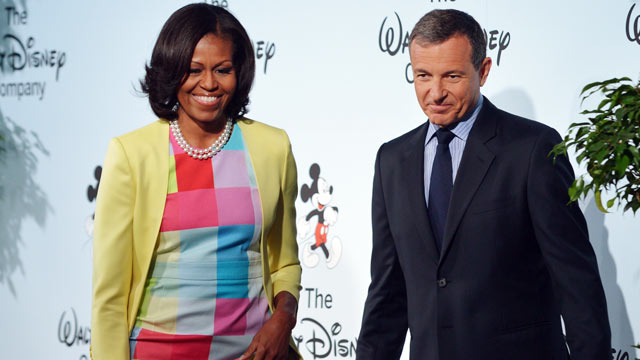 PHOTO: US First Lady Michelle Obama, with Walt Disney Company Chairman and CEO Robert Iger, after speaking at a press conference to announce changes to Disneys nutrition guideline policy on June 5, 2012 at the Newseum in Washington.
