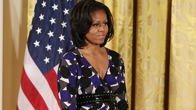 PHOTO: First lady Michelle Obama stands on stage during an awards ceremony for the President's Committee on the Arts and the Humanities in the East Room at the White House on November 19, 2012 in Washington, DC.