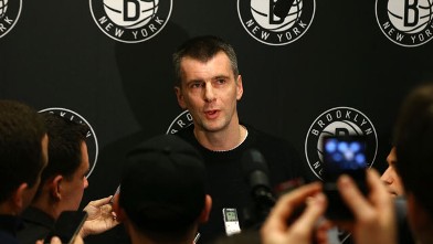 PHOTO: Brooklyn Nets owner Mikhail Prokhorov speaks to the media during half time of a game against the Charlotte Bobcats at Barclays Center, Dec. 28, 2012, in the Brooklyn borough of New York City.