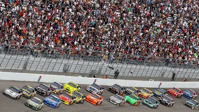 PHOTO: Carl Edwards driver of the #99 Scott's/ Kellogg's Ford leads a pack of cars down the front stretch during the NASCAR Sprint Cup Series Kobalt Tools 400 at Las Vegas Motor Speedway, March 6, 2011 in Las Vegas, Nevada.