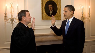 PHOTO: Chief Justice John G. Roberts Jr. administers the oath of office to President Barack Obama in the Map Room of the White House on Jan. 21, 2009.
