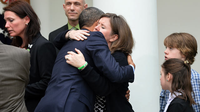 PHOTO: President Barack Obama embraces family members of Newtown school shooting victims, during a press conference at the Rose Garden of the White House in Washington, DC, April 17, 2013.