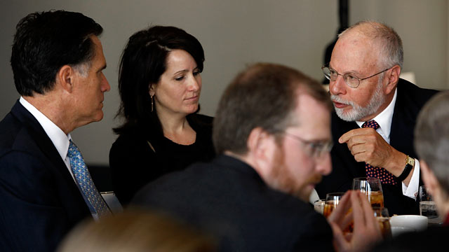 PHOTO: Paul Singer, right, has a conversation with GOP presidential hopeful Mitt Romney, left, during a forum of the Foreign Policy Initiative.