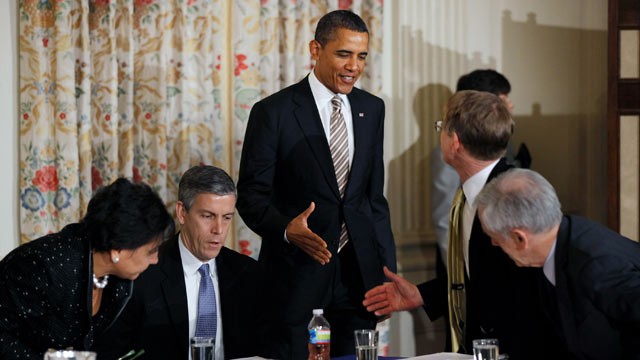 PHOTO: U.S. President Barack Obama, center, greets members of his Council on Jobs and Competitiveness while Education Secretary Arne Duncan, second from left, looks over documents before a meeting of council at the White House in Washington, D.C., Jan. 17