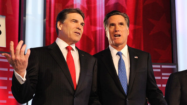 PHOTO: Rick Perry, left, and Mitt Romney await for the start of the GOP debate on the campus of Drake University in this Dec. 10, 2011 file photo.