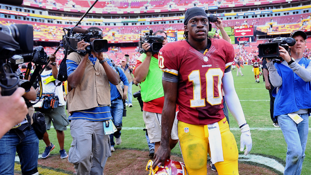 PHOTO: Washington Redskins quarterback Robert Griffin III leaves the field, Sept. 23, 2012 at FedE Field in Landover, MD.