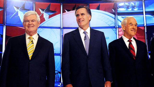 PHOTO: Republican candidates former House Speaker Newt Gingrich, former Governor Mitt Romney and U.S. Rep. Ron Paul participate in a debate, June 13, 2011 in Manchester, New Hampshire.