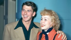 PHOTO: Ronald Reagan (1911-–2004), wearing a beige jacket with dark blue shirt with a wide collar, and his wife, Jane Wyman (1917-2007), U.S. actress, wearing a red coat with a dark blue neckscarf and black leather gloves, both smiling, circa 1945.