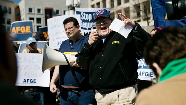 PHOTO: Donald Duncan yells into a megaphone during a demonstration by federal employees outside the Department of Labor in Washington, March 20, 2013.