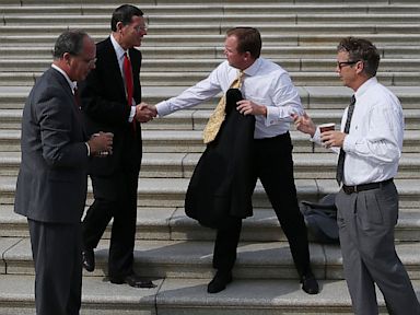 PHOTO: Rep. Rep. Mick Mulvaney (R-SC), Sen. John Barrasso (R-KY), Rep. Brett Guthrie (R-KY) and Sen. Rand Paul (R-KY) take a coffee break on the Senate steps at the U.S. Capitol October 3, 2013 in Washington, DC.