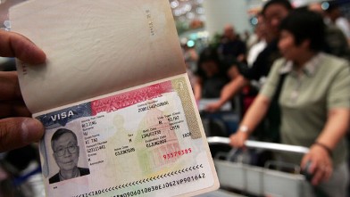 PHOTO: A U.S. visa is shown by a tourist in Beijing, China.