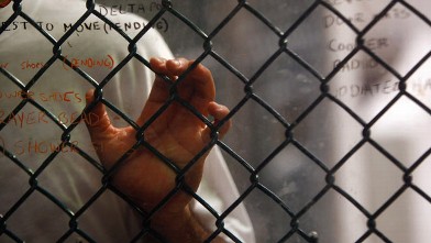 PHOTO: A detainee stands at an interior fence at the U.S. military prison for "enemy combatants" October 28, 2009 in Guantanamo Bay, Cuba.