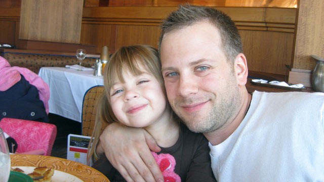 PHOTO: Jonathan Agin poses for a family photograph with his daughter, Alexis.