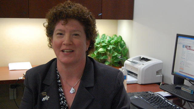PHOTO: Kemetia Foley sits at her secretarys desk.