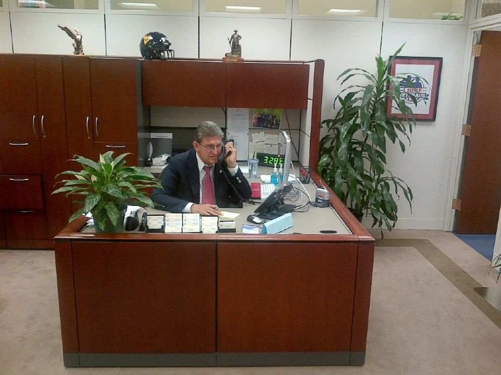 PHOTO: West Virginia Senator Joe Manchin is seen answering his own phones during the government shutdown.