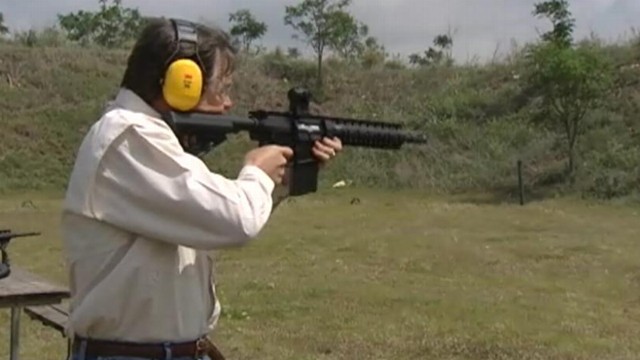 VIDEO: Governor Rick Perry fires assault rifle at gun range.