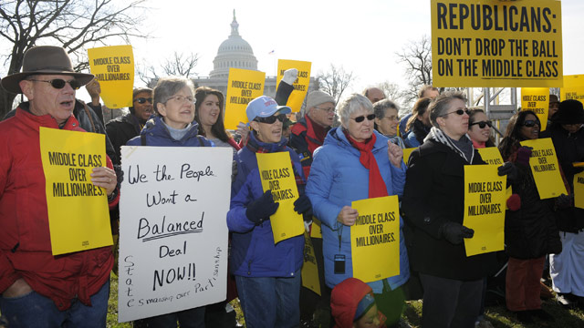 PHOTO: Families and small business owners gather outside the US Capitol to protest inaction by Congress to pass legislation to avoid the fiscal cliff, Dec. 28, 2012, in Washington, DC.