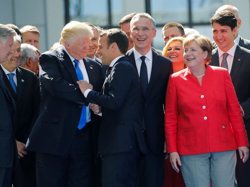 PHOTO: President Donald Trump jokes with French President Emmanuel Macron about their prior hand shake which had drawn attention for its intensity, during an event with other NATO leaders in Brussels, May 25, 2017.
