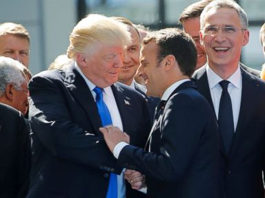 PHOTO: President Donald Trump jokes with French President Emmanuel Macron about their prior hand shake which had drawn attention for its intensity, during an event with other NATO leaders in Brussels, May 25, 2017.