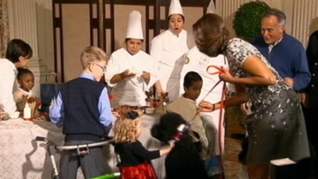 VIDEO: The newest member of the Obama family helped the first lady spread holiday cheer.