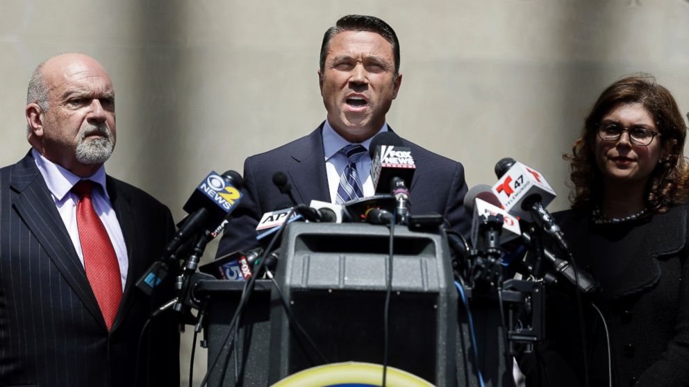 PHOTO: U.S. Rep. Michael Grimm, center, speaks to the media outside of federal court in New York, April 28, 2014.