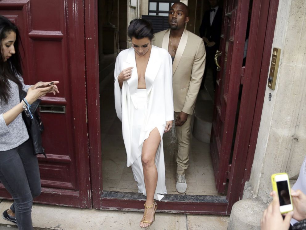 PHOTO: Kim Kardashian and Kanye West leave their residence in Paris, May 23, 2014, ahead of their wedding.