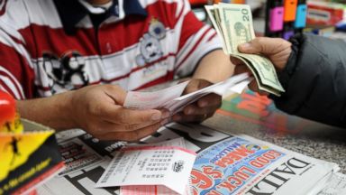 PHOTO: A clerk sells Mega Millions lottery tickets at a convenience store on the east side of Manhattan, March 30, 2012, in New York.