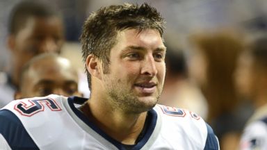 PHOTO: Tim Tebow looks on during warm-ups prior to the game against the Detroit Lions at Ford Field, Aug. 22, 2013 in Detroit, Mich.