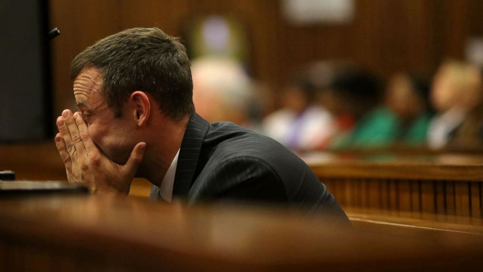 PHOTO: Oscar Pistorius sits in the dock as he listens to cross questioning in court during his trial in Pretoria, South Africa, March 10, 2014.