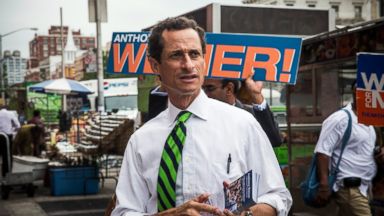 PHOTO: New York City mayoral hopeful Anthony Weiner meets with people on a street corner In Harlem in this September 10, 2013 file photo taken in New York City.
