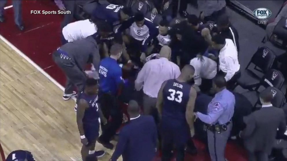 A college basketball player collapsed on the court during a game and