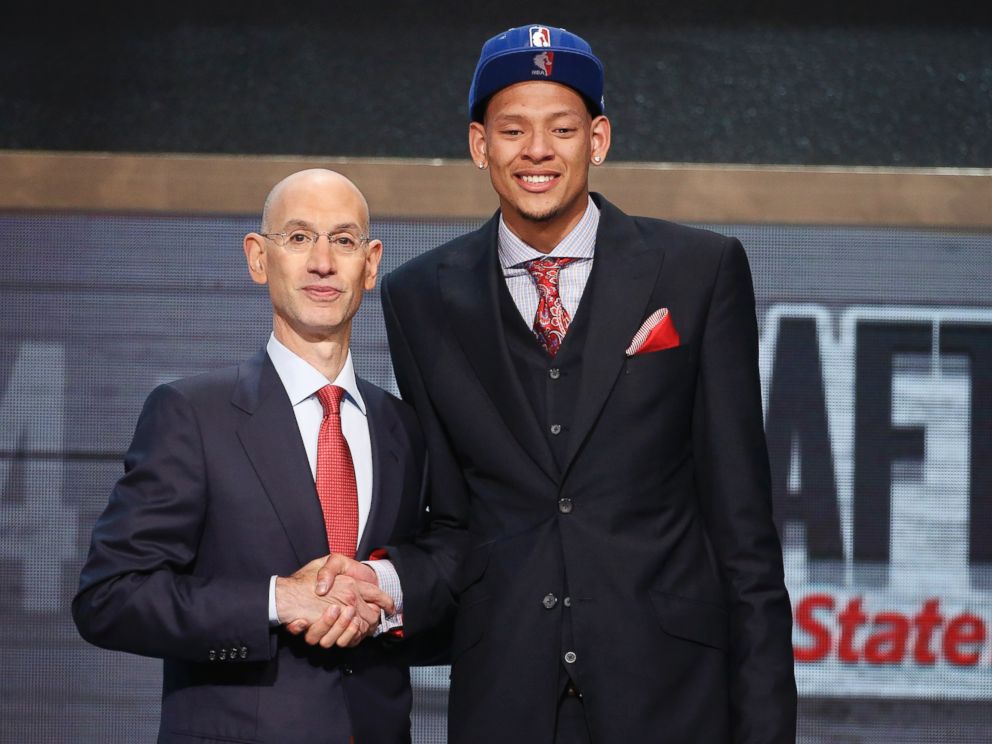 PHOTO: Baylor center Isaiah Austin, right, poses for a photo with NBA Commissioner Adam Silver after being granted a ceremonial first round pick during the 2014 NBA draft, June 26, 2014, in New York.