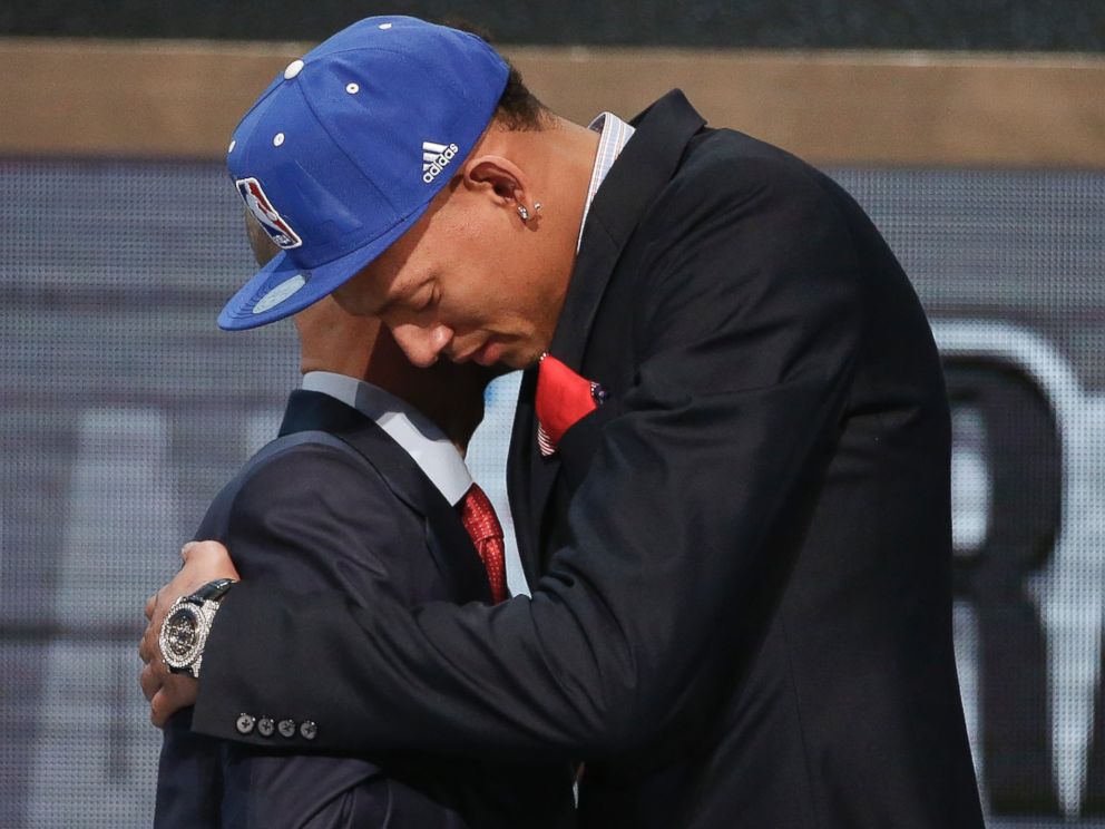 PHOTO: Baylor center Isaiah Austin, right, hugs NBA Commissioner Adam Silver after being granted a ceremonial first round pick during the 2014 NBA draft, June 26, 2014, in New York.