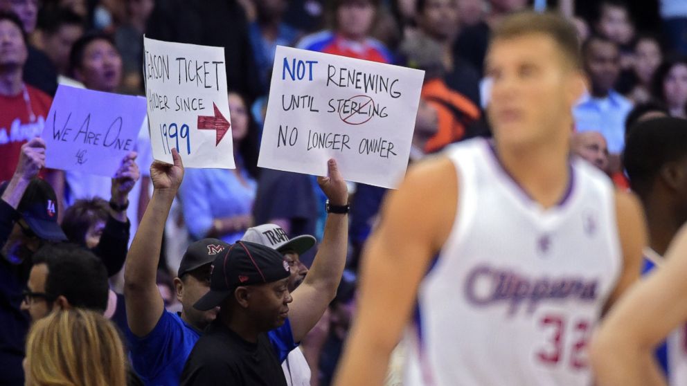PHOTO: Fans hold up signs as Los Angeles Clippers forward Blake Griffin looks on during the second half in Game 5 of an opening-round NBA basketball playoff series against the Golden State Warriors, Tuesday, April 29, 2014, in Los Angeles.