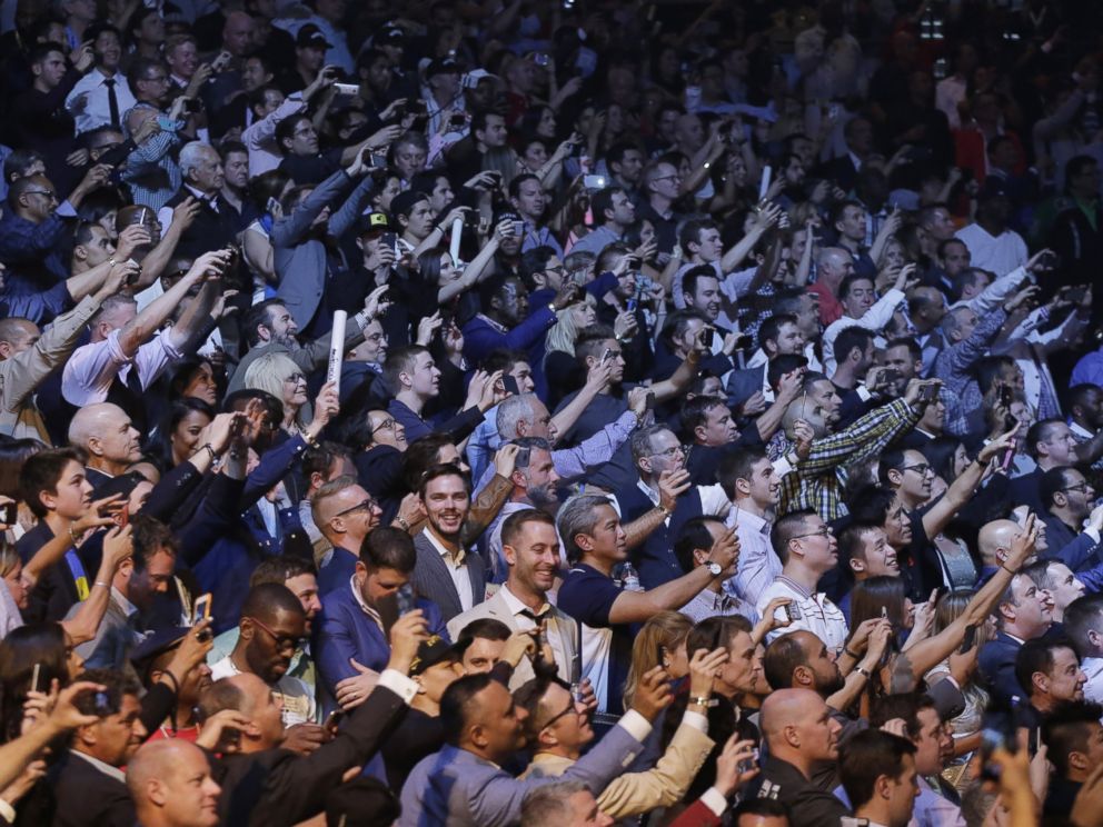 PHOTO: Spectators take mobile photos before the start of the world welterweight championship bout between Floyd Mayweather Jr., and Manny Pacquiao, on Saturday, May 2, 2015 in Las Vegas.