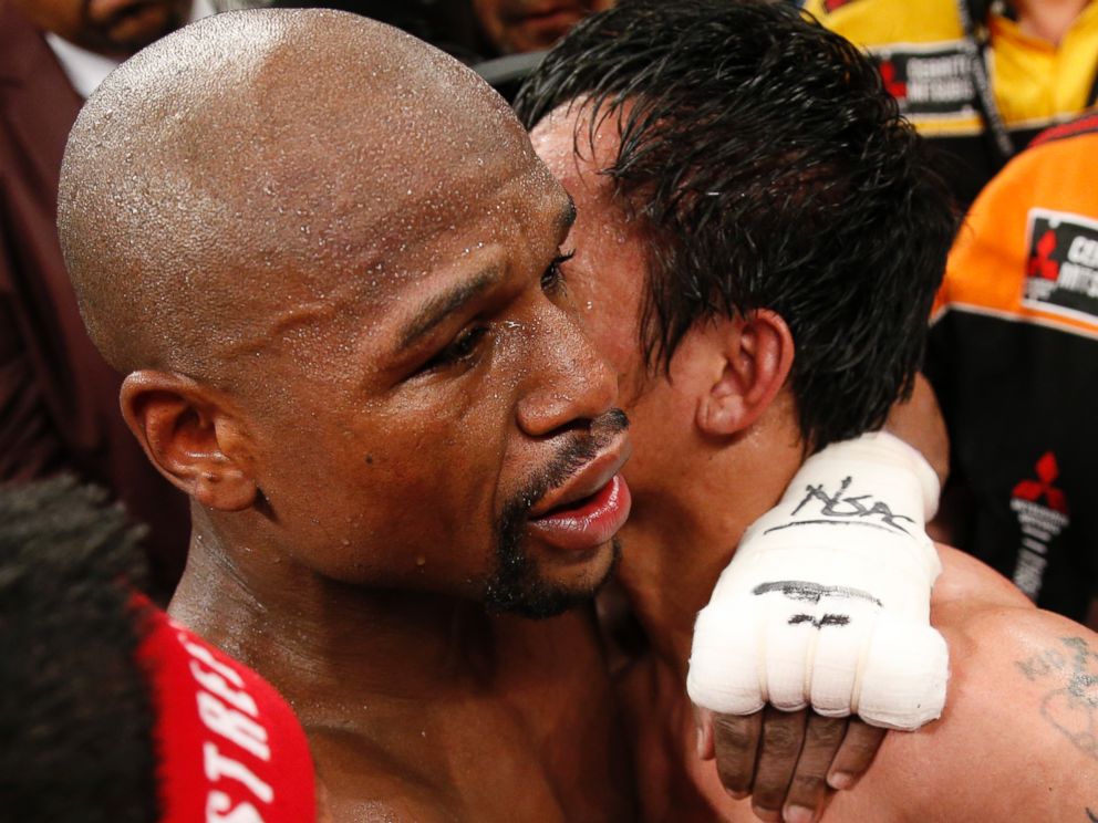 PHOTO:Floyd Mayweather Jr., left, and Manny Pacquiao, from the Philippines, embrace in the ring at the finish of their welterweight title fight on Saturday, May 2, 2015 in Las Vegas.