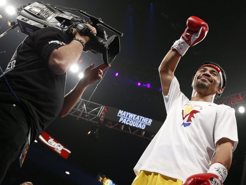 PHOTO: Manny Pacquiao, from the Philippines, acknowledges the crowd before the start of his world welterweight championship bout against Floyd Mayweather Jr., on Saturday, May 2, 2015 in Las Vegas.