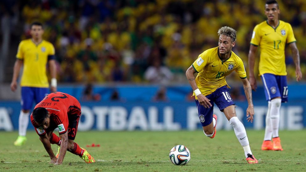 PHOTO: Brazils Neymar runs with the ball during the group A World Cup soccer match between Brazil and Mexico at the Arena Castelao in Fortaleza, Brazil, June 17, 2014.