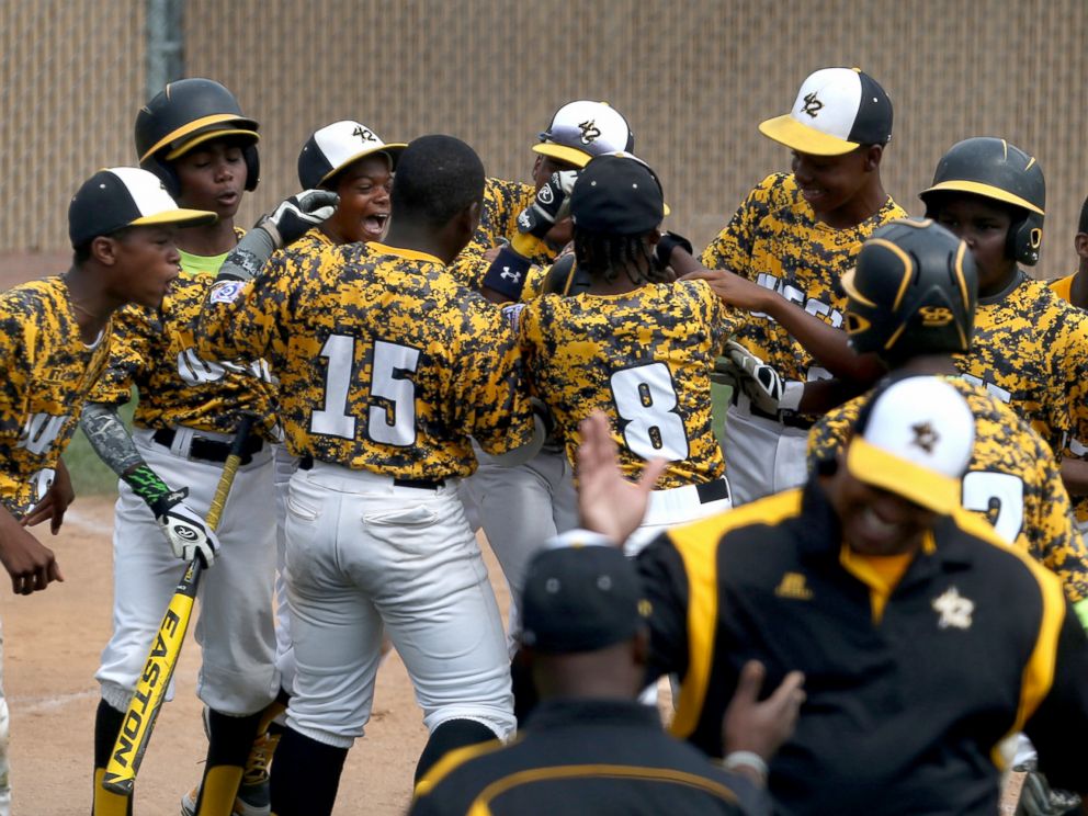 PHOTO: Jackie Robinson West Little Leaguers from Chicago celebrate their win over New Albany, Ind., in the Little League Central Regional baseball championship game in Lawrence, Ind., Aug. 9, 2014.