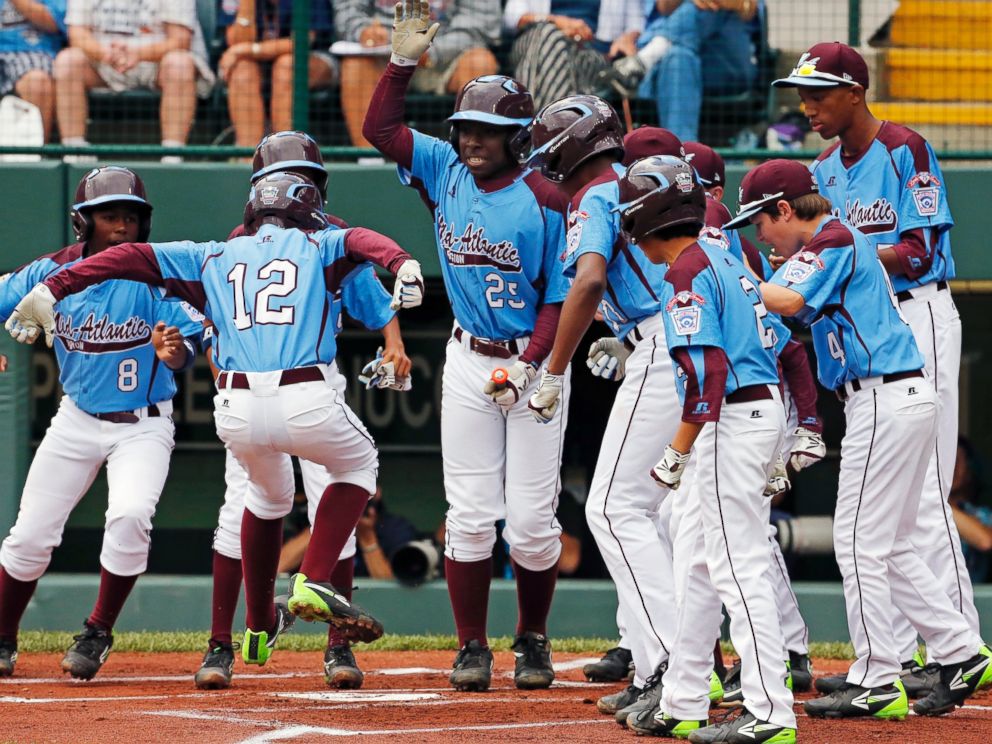 PHOTO: Pennsylvanias Jared Sprague-Lott jumps onto home plate after hitting a three-run home run