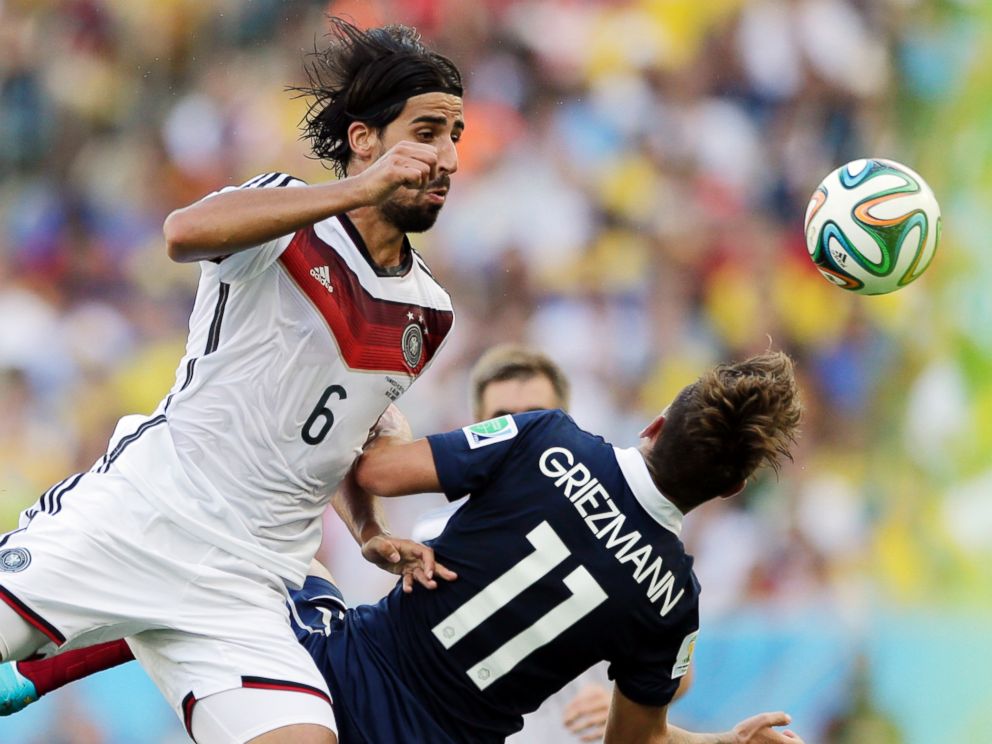 PHOTO: Germanys Sami Khedira heads the ball against Frances Antoine Griezmann during the World Cup quarterfinal soccer match at the Maracana Stadium in Rio de Janeiro, Brazil, July 4, 2014.